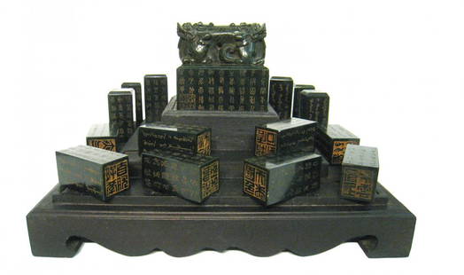 Chinese Qing Imperial Green Jade Seals In Zitan Box: Large central seal with 18 smaller seals. Zitan box with finely carved cover. Qing dynasty. Box measures 9 1/2" X 13 1/2".Shipping: We are able to pack and ship this item to an address in the United