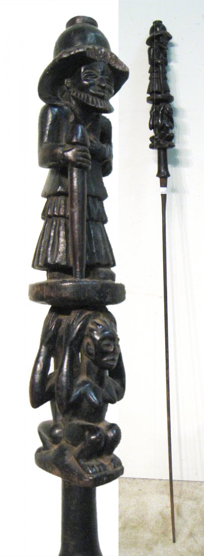 African Spear: 60" in length, with carved wood head. Shipping: We are unable to ship this item. Please contact our local UPS Store, store1152@theupsstore.com, or the Packaging Store, hello@packandshipnow.com, for a 