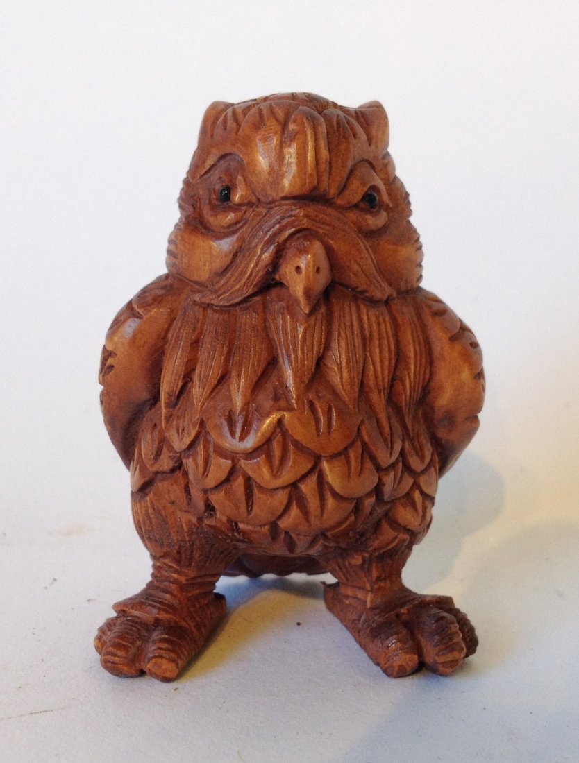 Carved Boxwood Japanese Netsuke: A 42 mm carved owl in the standing position. Shipping: We are able to pack and ship this item to an address in the United States for $15.00 via USPS Priority Mail. Tracking information will be sent to