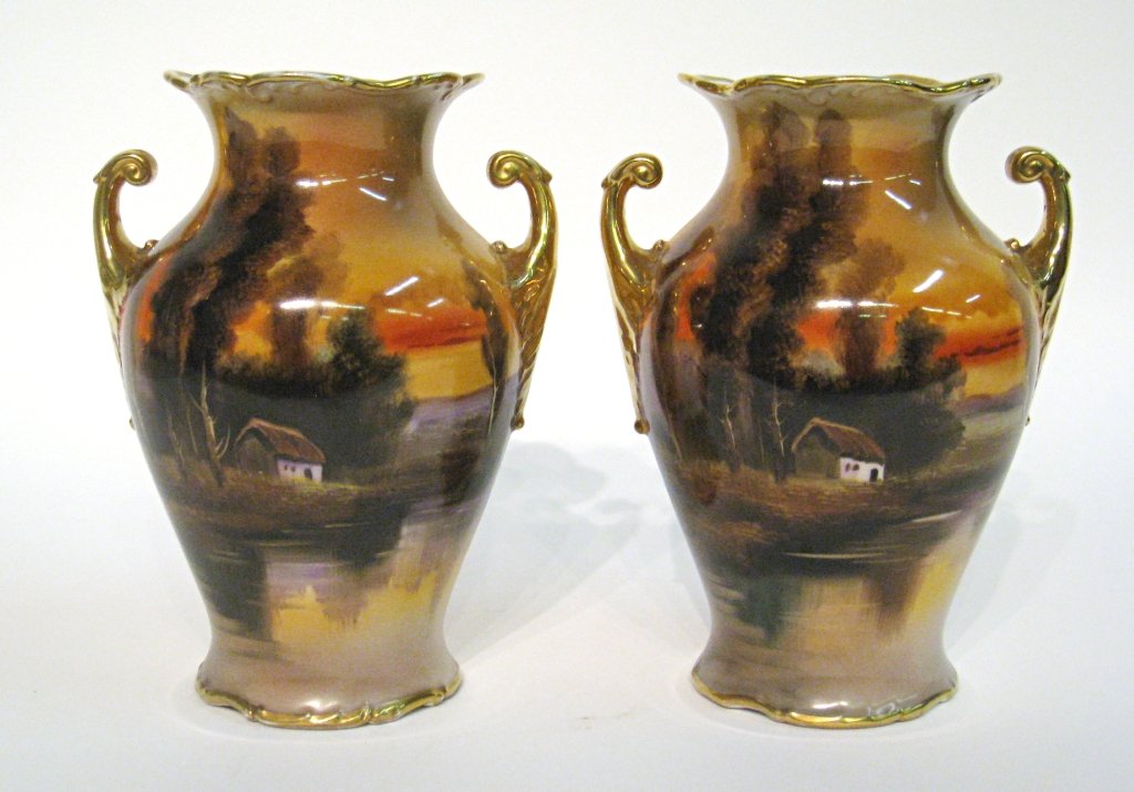 A Pair Of Garniture Vases: A pair of 9" polychrome glazed vases marked Noritake, Japan. Shipping: We are able to pack and ship this item to an address in the United States for $50.00 via USPS Priority Mail or via FedEx Ground/H