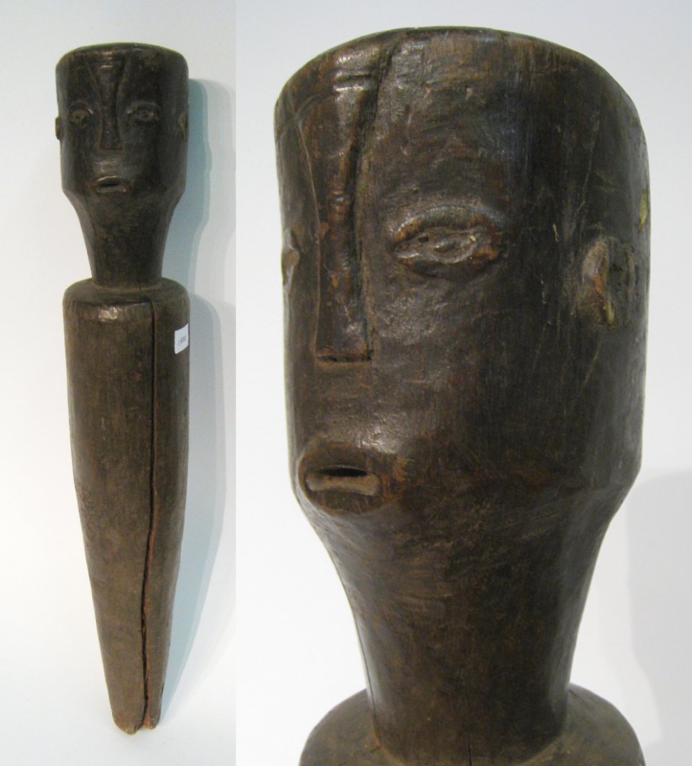 African Tanzanian Fetish Figure: A carved 10th century reportedly of Tanzanian origin. Note splitting from wood shrinkage, to confirm its antique age. 24" in height Shipping: We are unable to ship this item. Please contact our local 