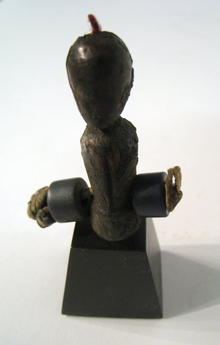 African Charm Figure: Antique, probably 19th century 3 1/4" with base. Shipping: We are able to pack and ship this item to an address in the United States for $25.00 via USPS Priority Mail. Tracking information will be sen