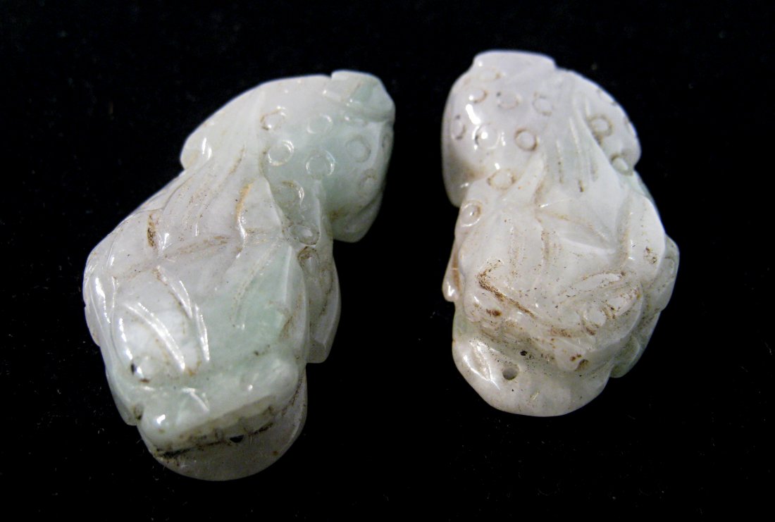 Carved Jade Items: A pair, two 2" carved greenish jade foo dogs. Shipping: We are able to pack and ship this item to an address in the United States for $25.00 via USPS Priority Mail. Tracking information will be sent t
