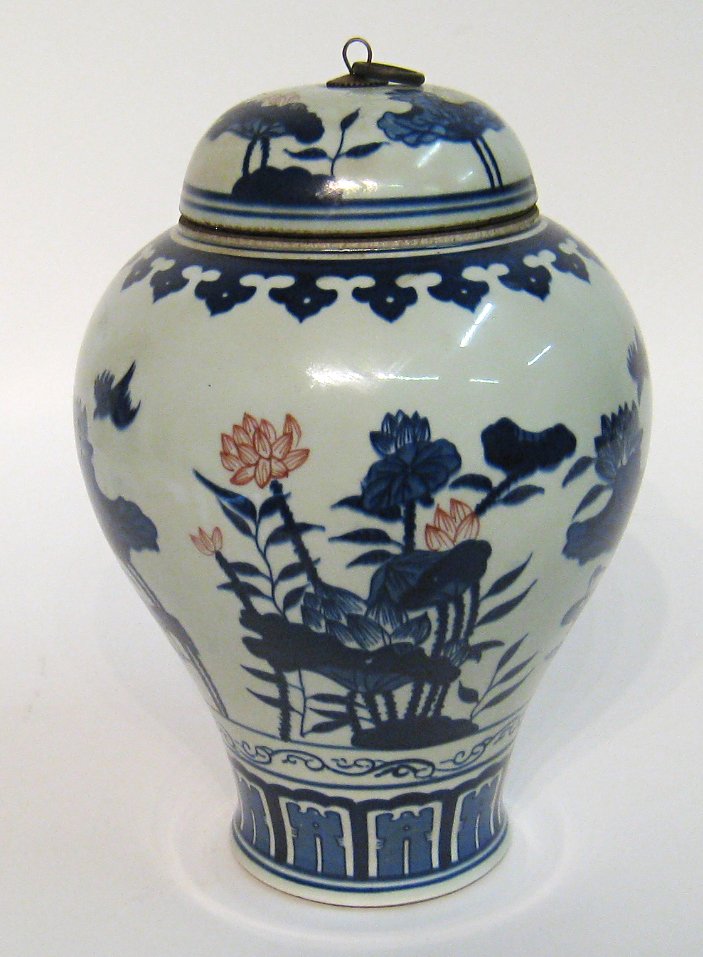 Lidded Blue And White Jar: In the Qianlong style of the late 18th century, about 11 1/2" tall. Shipping: We are able to pack and ship this item to an address in the United States for $50.00 via USPS Priority Mail or via FedEx G