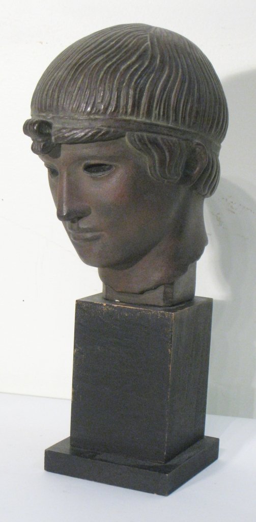 Bust Of Roman Citizen: A Roman style bust mounted on a stand. About 12" tall. Shipping: We are able to pack and ship this item to an address in the United States for $50.00 via USPS Priority Mail or via FedEx Ground/Home De