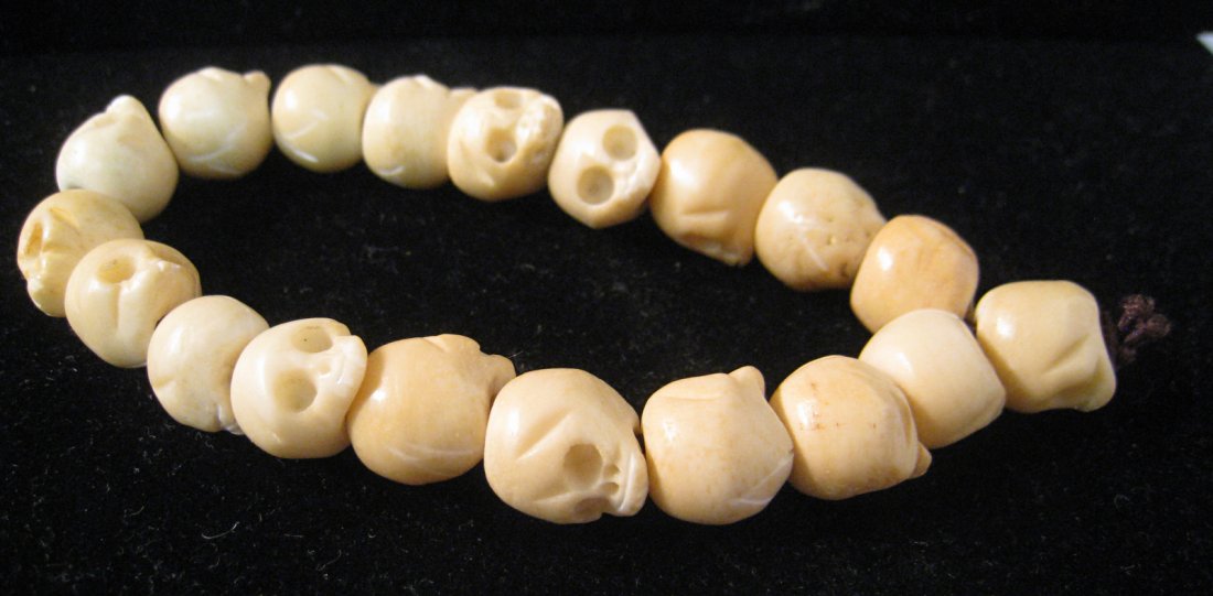 Tibet Buddhist Mala: Apparently of carved oxbone, depicting human skulls (!). Shipping: We are able to pack and ship this item to an address in the United States for $15.00 via USPS Priority Mail. Tracking information wil