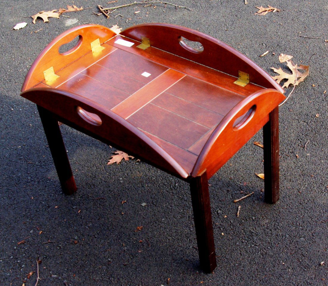 Butler's Table: A two piece butler's table, having a frame supporting a tray table top with hinged sides. When folded the top measures 28" X 17". Shipping: We are unable to ship this item. Please contact our local UP