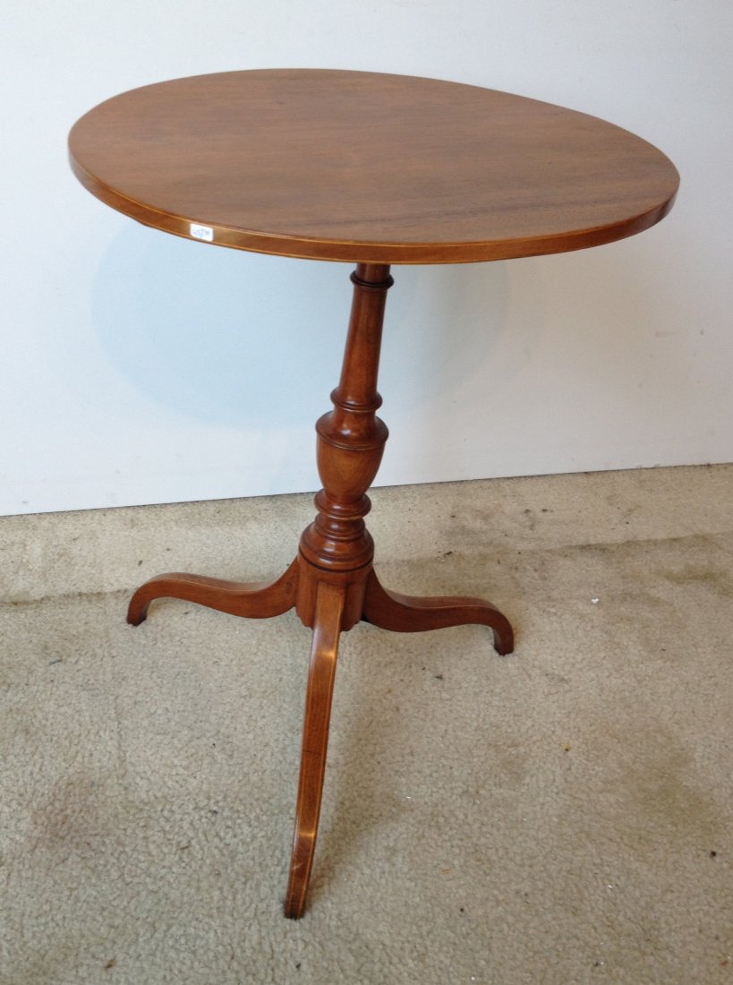 Oval Topped Tilt Top Candlestand: In solid walnut, with stringing inlay, probably Maryland. 28" tall Shipping: We are unable to ship this item. Please contact our local UPS Store, store1152@theupsstore.com, or the Packaging Store, hel