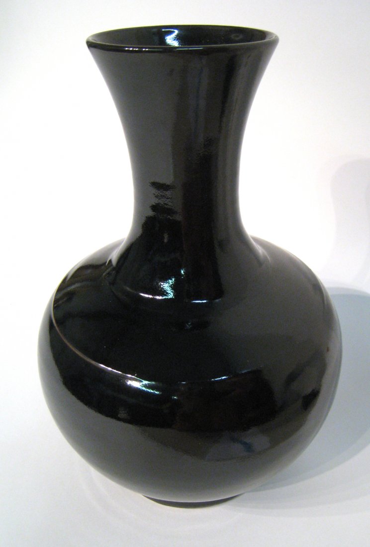 Black Glaze Chinese Vase: A 13" dark blue or black glazed porcelain bottle, late Qing dynasty. About 13" tall. Shipping: We are able to pack and ship this item to an address in the United States for $50.00 via USPS Priority Ma