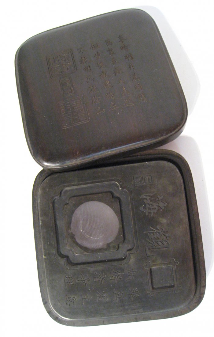 Duan Inkstone In Zitan Box: Carved Duan ink stone enclosed within a Zitan box, about 8" square. Shipping: We are able to pack and ship this item to an address in the United States for $30.00 via USPS Priority Mail. Tracking info
