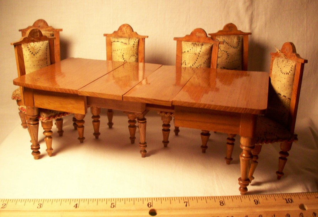 Dollhouse Table And Chairs: A dining room table with two extra leaves and ensemble with six upholstered chairs. Shipping: We are able to pack and ship this item to an address in the United States for $40.00 via USPS Priority Mai