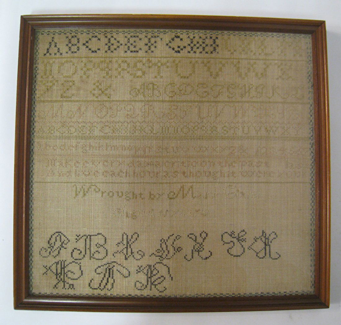 Sampler By Mary Smith: Signature appears to be Mary Smith. A framed cross stitch alphanumeric sampler, 18" X 19". Shipping: We are able to pack and ship this item to an address in the United States for $55.00 via USPS Prior