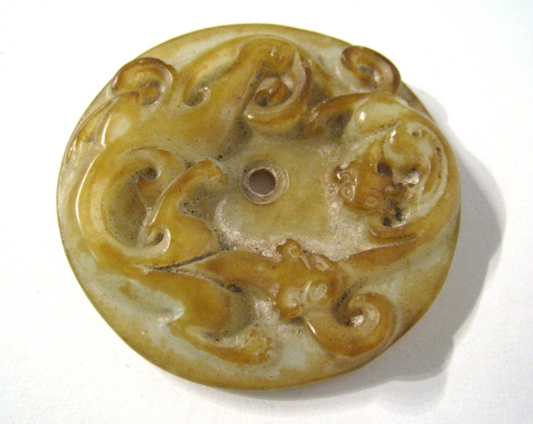 Chinese Hardstone Rosette: An antique 2" carved jade or hardstone with a central hole. Shipping: We are able to pack and ship this item to an address in the United States for $15.00 via USPS Priority Mail. Tracking information 