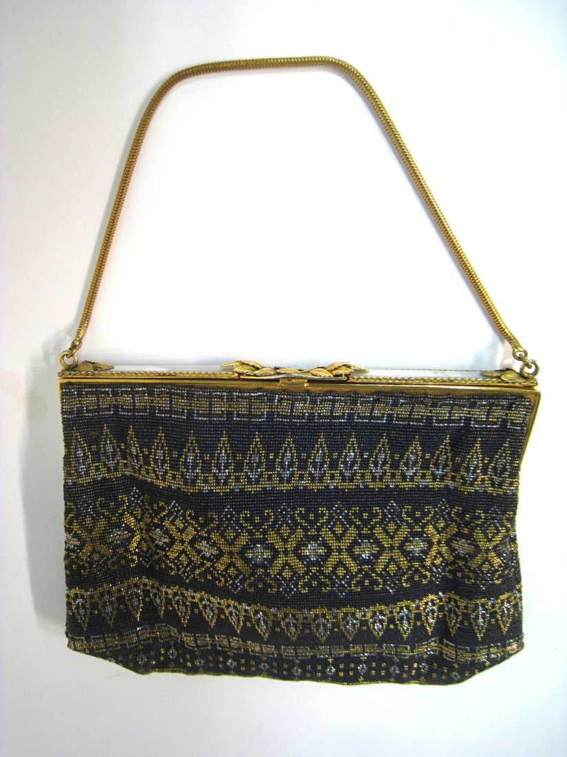 Good Ladies Purse: A "Hand made" French purse of meshed or beaded construction featuring nacre and ormolu clasp and silk lining, 6" X 8". Shipping: We are able to pack and ship this item to an address in the United Stat