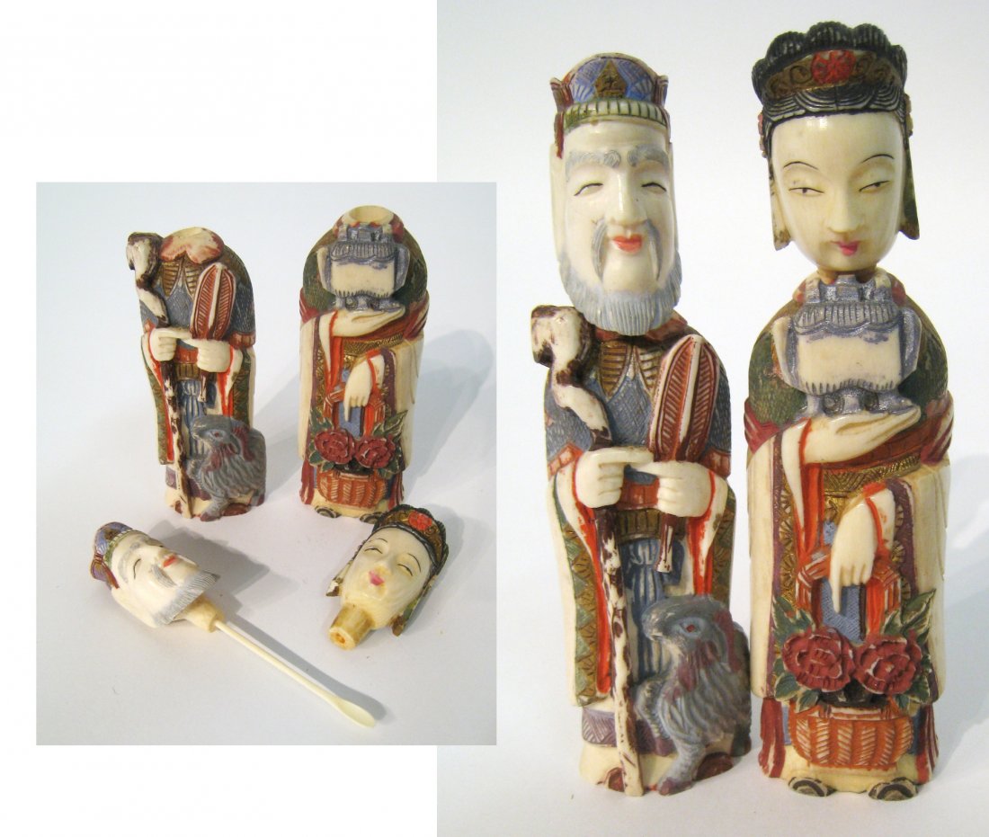 Chinese Ivory Snuffs: An unusual pair of snuff bottles in the form of a Chinese wise man and woman whose heads form lids of the bottles. Each carefully hand painted and carved in detail., 5" in height. Shipping: We are abl
