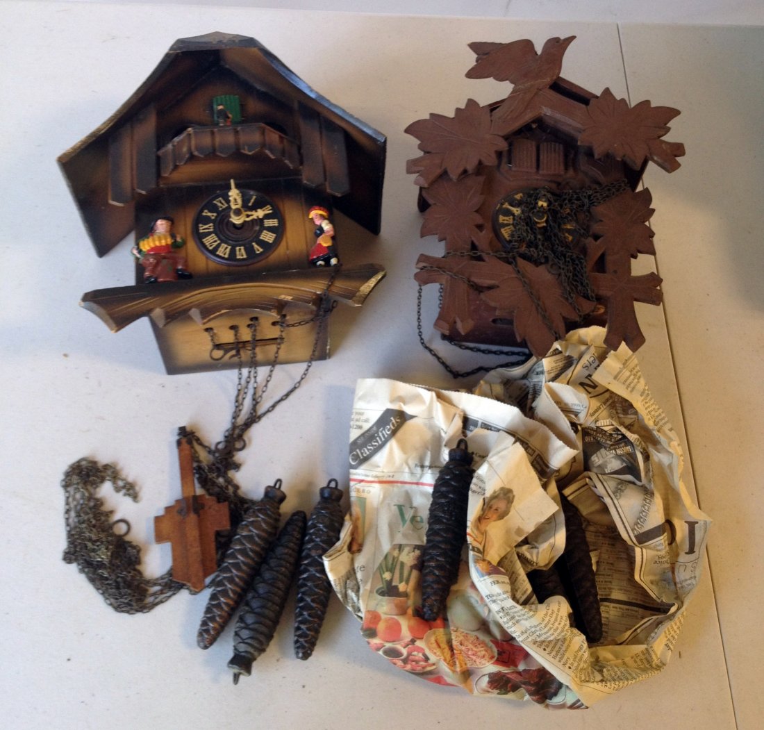 Two Cuckoo Clocks: Two carved case cuckoo clocks,each the three weight type. Repairs needed and lacking one pendulum. Shipping: We are unable to ship this item. Please contact our local UPS Store, store1152@theupsstore.