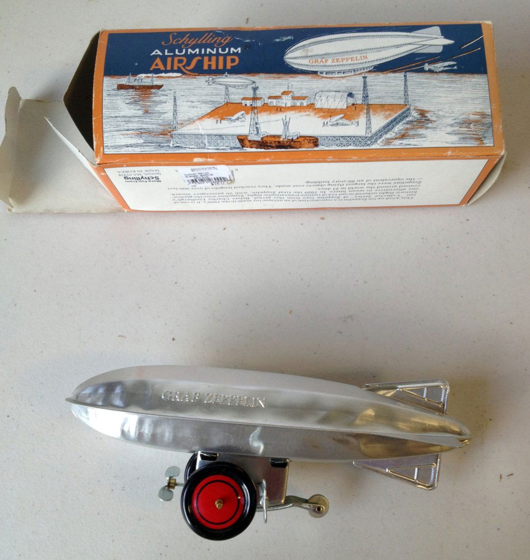 Graf Zepplin Wind Up Toy.: Wind up model of the airship with original box and in mint condition. Shipping: We are able to pack and ship this item to an address in the United States for $40.00 via USPS Priority Mail or via FedEx
