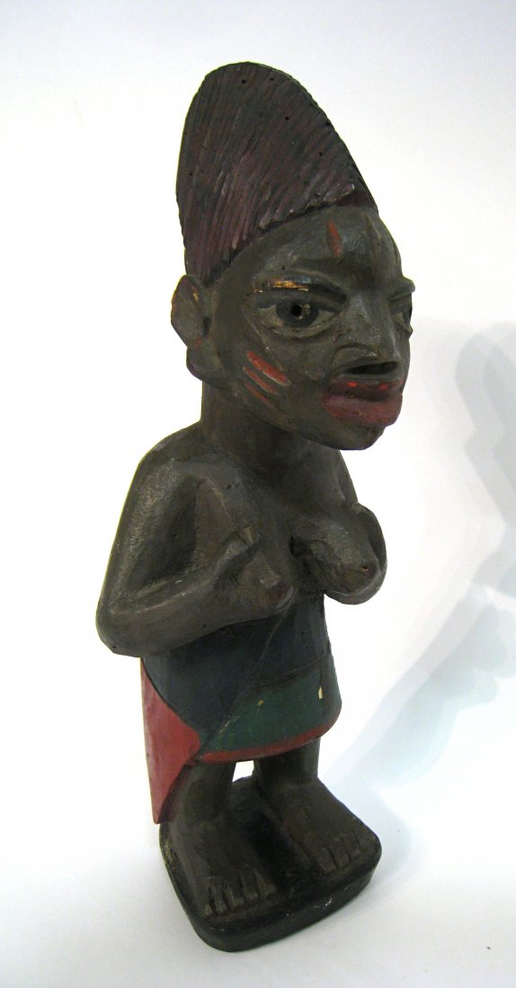 African Standing Figure: Carved and painted, a 13 " female figure Shipping: We are able to pack and ship this item to an address in the United States for $50.00 via USPS Priority Mail or via FedEx Ground/Home Delivery. Tracki