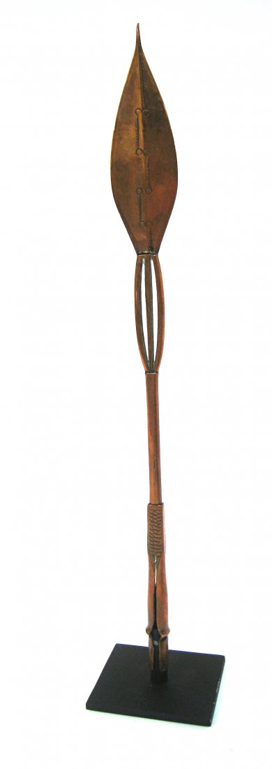 19th Century African Longo Spear: 18" in length, with custom made display mounting. Shipping: We are able to pack and ship this item to an address in the United States for $25.00 via USPS Priority Mail. Tracking information will be se