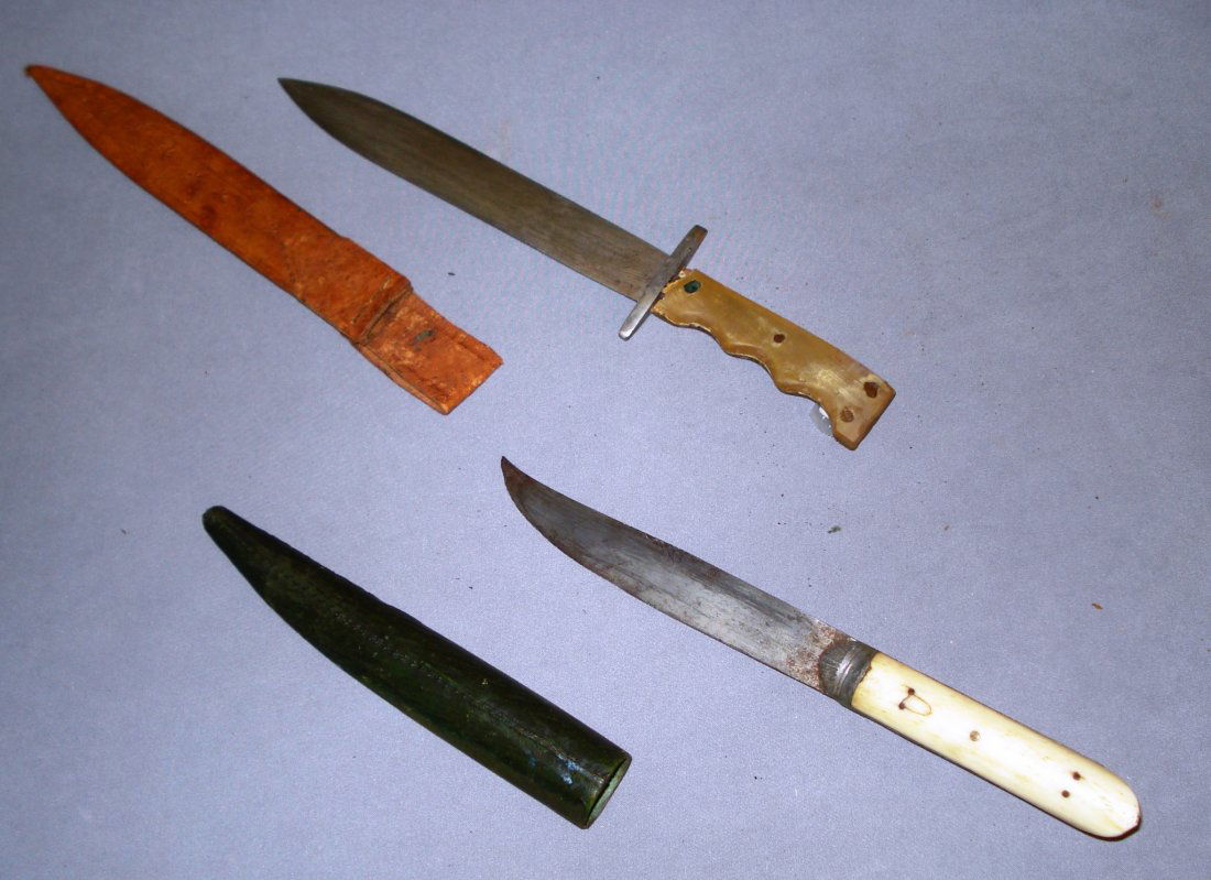 Two Bone Handled Knives: One with a tapered bone handle and steel blade and a sheath, the other, with damage, marked "Guatamala". Shipping: We are able to pack and ship this item to an address in the United States for $25.00