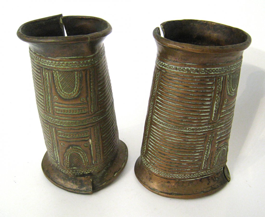 Pair Of Brass Punch Engraved Anklets: 18th century copper anklets of Nigerian origin. Shipping: We are able to pack and ship this item to an address in the United States for $40.00 via USPS Priority Mail or via FedEx Ground/Home Delivery.