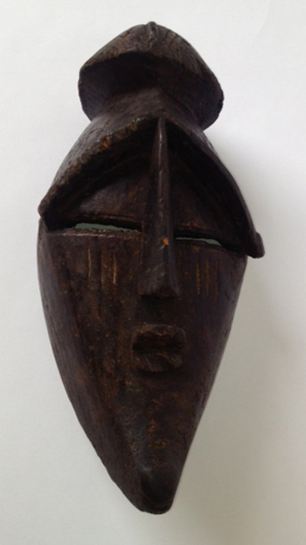 19th Century African Mask: A 19th 14 1/2" dance mask of Congolese origins from a private estate. Shipping: We are able to pack and ship this item to an address in the United States for $50.00 via USPS Priority Mail or via FedEx