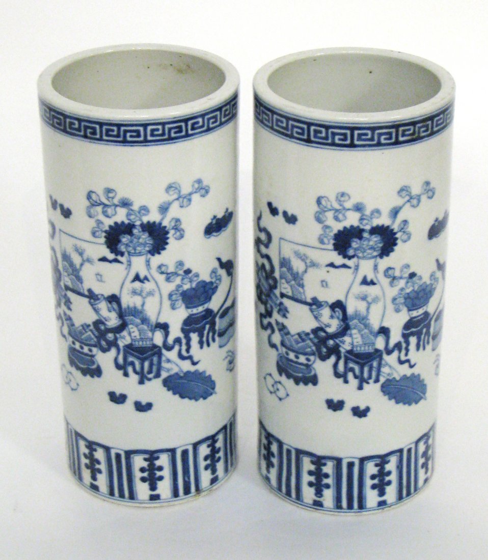 Pair Of Blue And White Cylindrical Vases: Chinese, in garniture form, 11" X 5". Shipping: We are able to pack and ship this item to an address in the United States for $50.00 via USPS Priority Mail or via FedEx Ground/Home Delivery. Tracking 