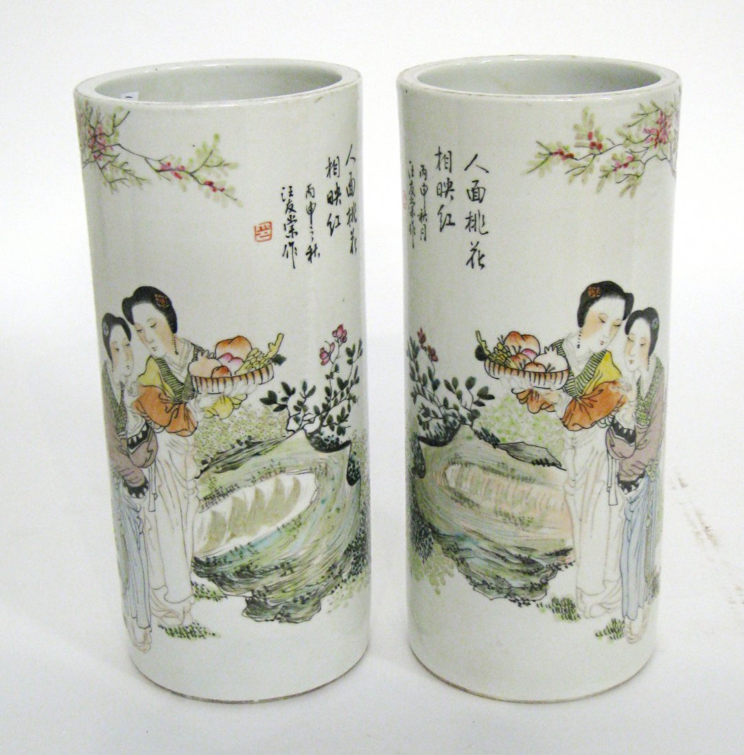 Pair Cylindrical Garniture Vases: These cylindrical garniture for flowers have figural scenes and calligraphy. 11" in height. Shipping: We are able to pack and ship this item to an address in the United States for $55.00 via USPS Prio