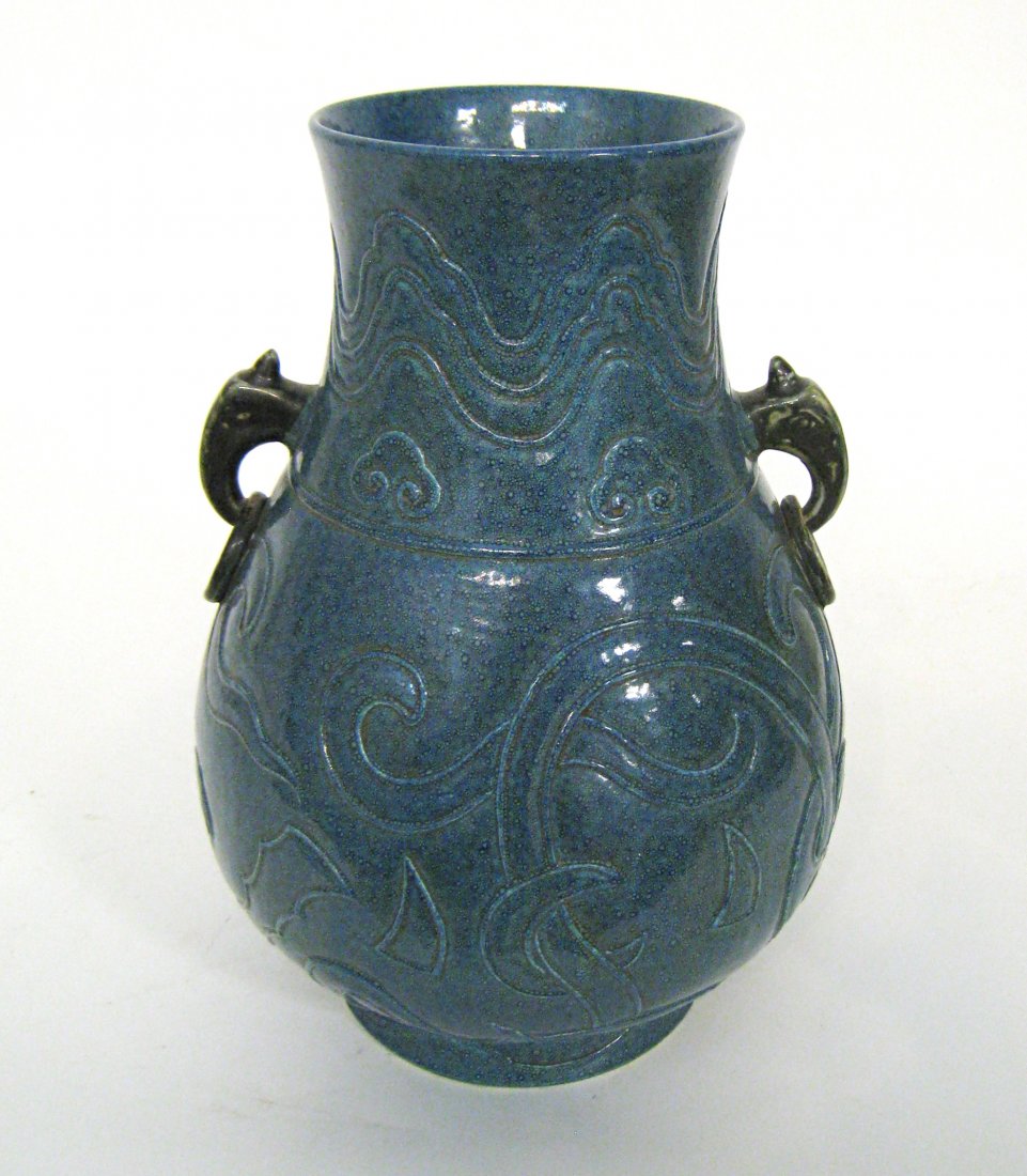 Chinese Qianlong Robin Egg Glazed Vase: A Chinese porcelain vase, 13" in height and with ringlet handles. Apparently with two color glazes in blue, the top layer having a fine bubble-like effervescent quality, and with stamped in musician d