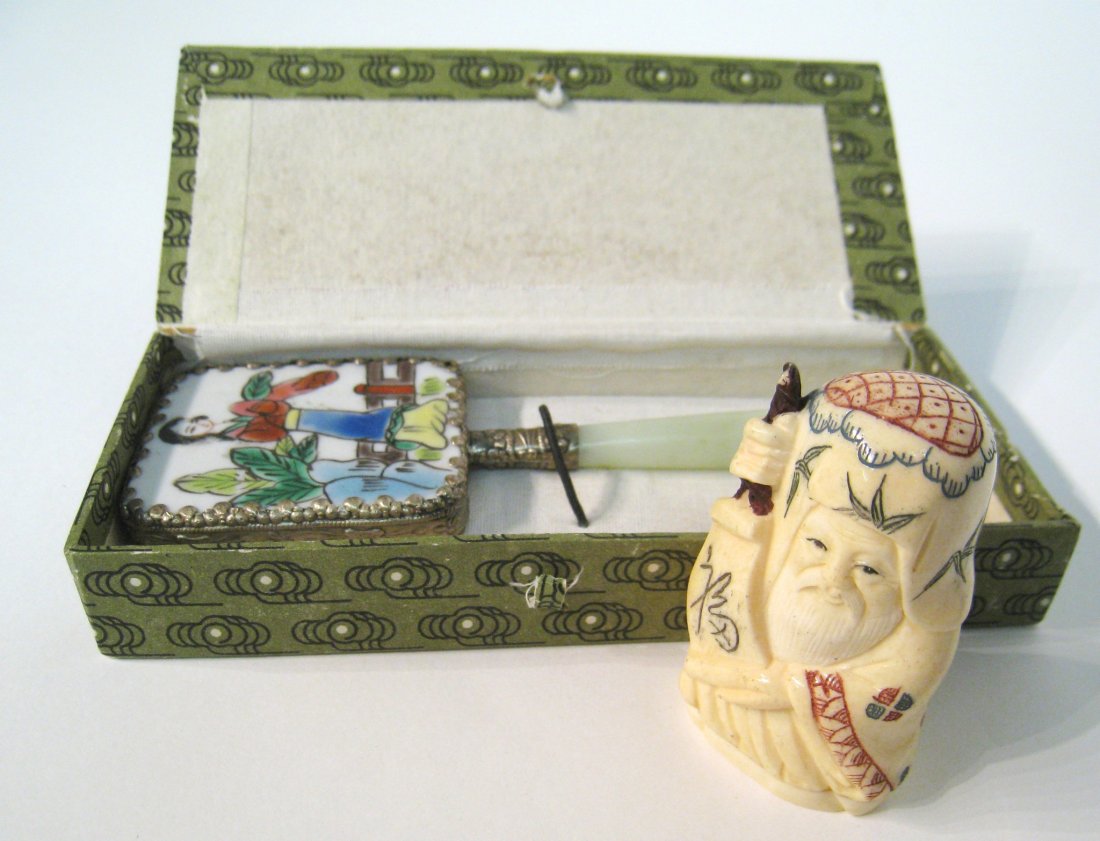 Chinese Bone Carving And Enamel Mirror: Enamel hand mirror together with carved bone image of an immortal. Shipping: We are able to pack and ship this item to an address in the United States for $25.00 via USPS Priority Mail. Tracking infor