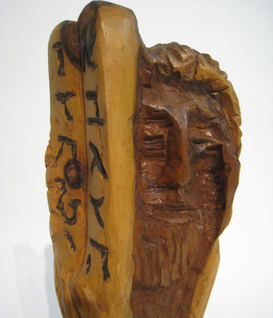 Wooden Moses Carving: Wooden carving of Moses with the ten commandments tablets. About 14" tall. Shipping: We are able to pack and ship this item to an address in the United States for $50.00 via USPS Priority Mail or via 