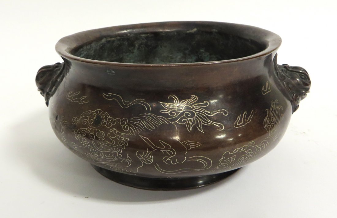 Chinese Bronze Censer: Bronze Censer, featuring holders in the form of a Foo Lion, with a fly dragon pattern on surface, and six character marks on the base. 8". Shipping: We are able to pack and ship this item to an addres