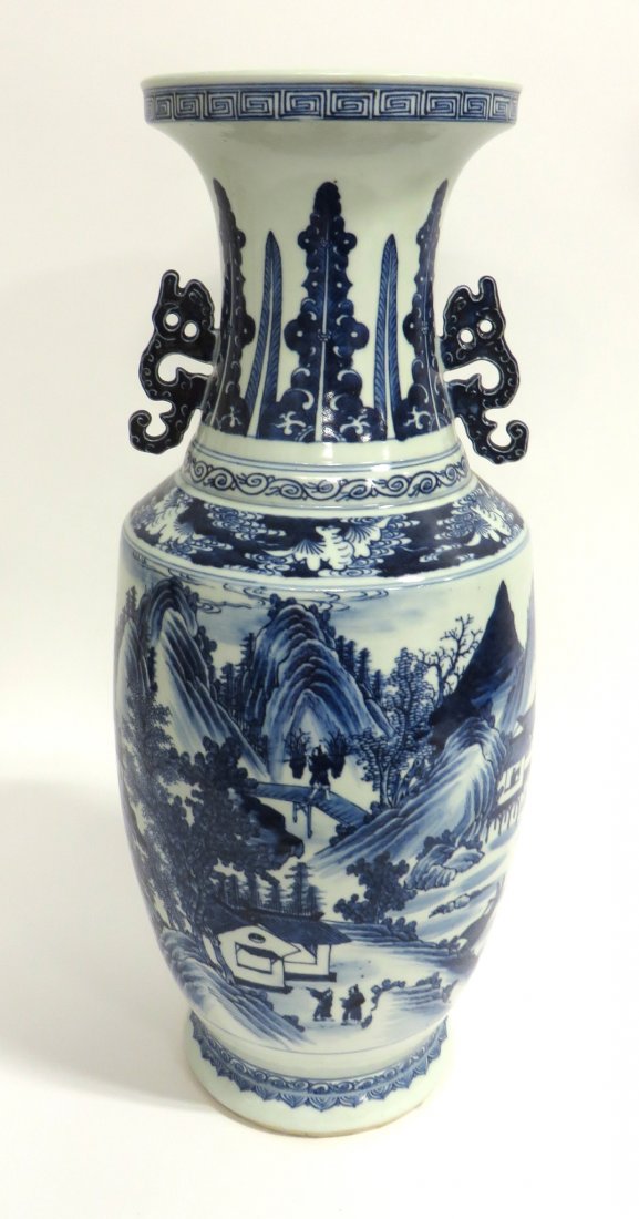 Later 19 C. Chinese Garniture: 19th c. vase depicting landscapes on one side, dragons on the other in blue and white. About 25" tall. Shipping: We are unable to ship this item. Please contact our local UPS Store, store1152@theupsst