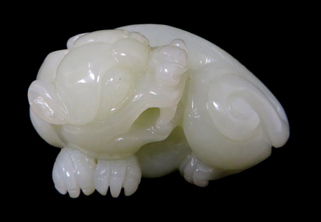 White Jade Foo-Lion Carving: White jade ornament, China, 19c. Carved Foo-lion carving. 244 grams. 3". Shipping: We are able to pack and ship this item to an address in the United States for $25.00 via USPS Priority Mail. Tracking