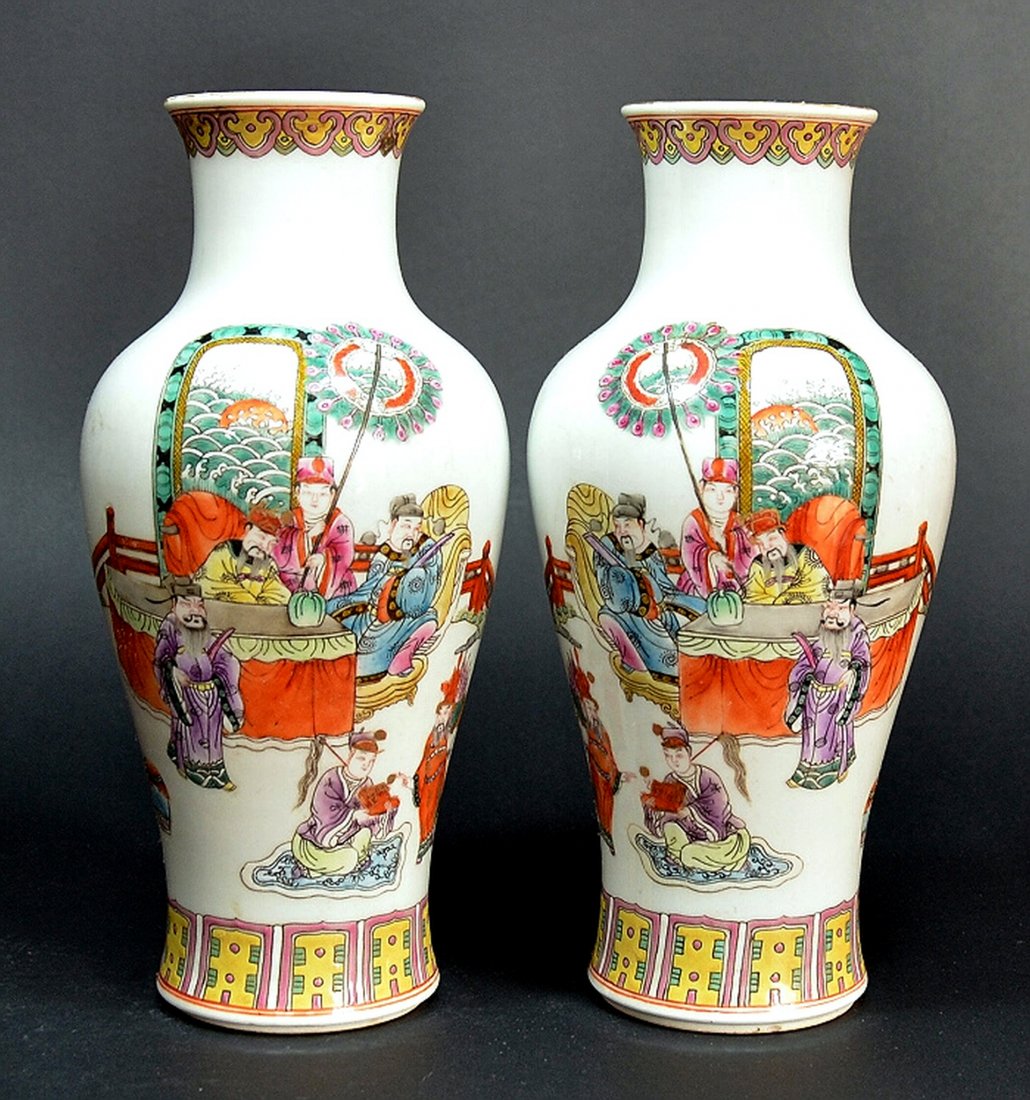 Pair Chinese Qing Famille Rose Vases: Pair of 19th C. porcelain garniture vases with two scenes , front and back, and a Jiaqing red mark on base. Each 12" tall. Shipping: We are able to pack and ship this item to an address in the United 