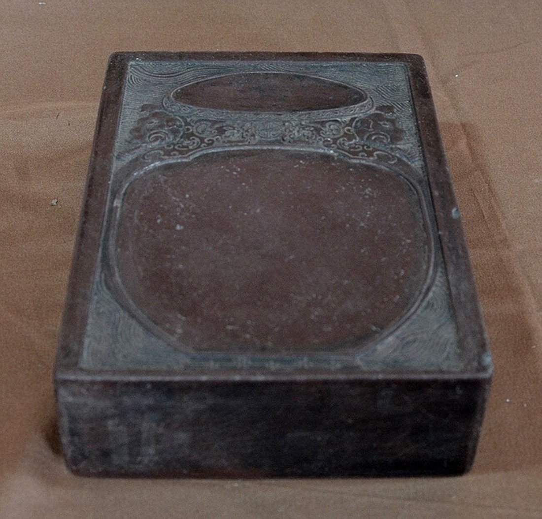 Carved Duan Inkstone: Duan ink-stone, carved with landscape and cloud pattern. 5 1/2" X 8". Shipping: We are able to pack and ship this item to an address in the United States for $40.00 via USPS Priority Mail or via FedEx