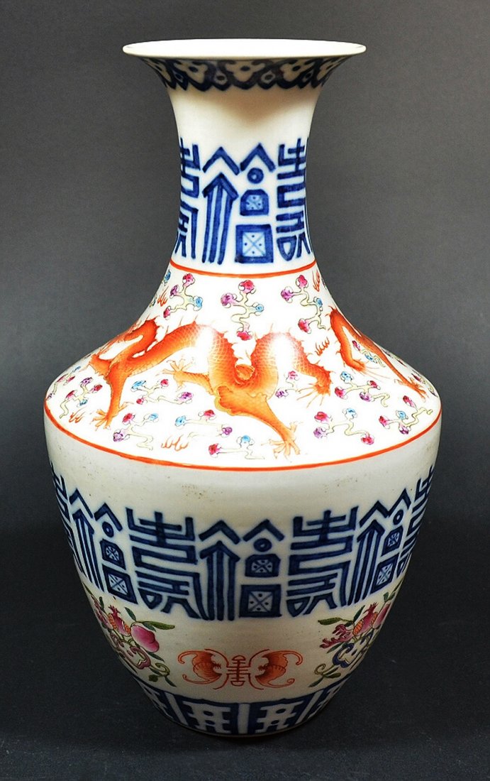 Chinese Porcelain Vase: Porcelain vase, decorated with red flying dragon and Chinese shou character. Qianlong mark on base. About 12" tall. Shipping: We are able to pack and ship this item to an address in the United States