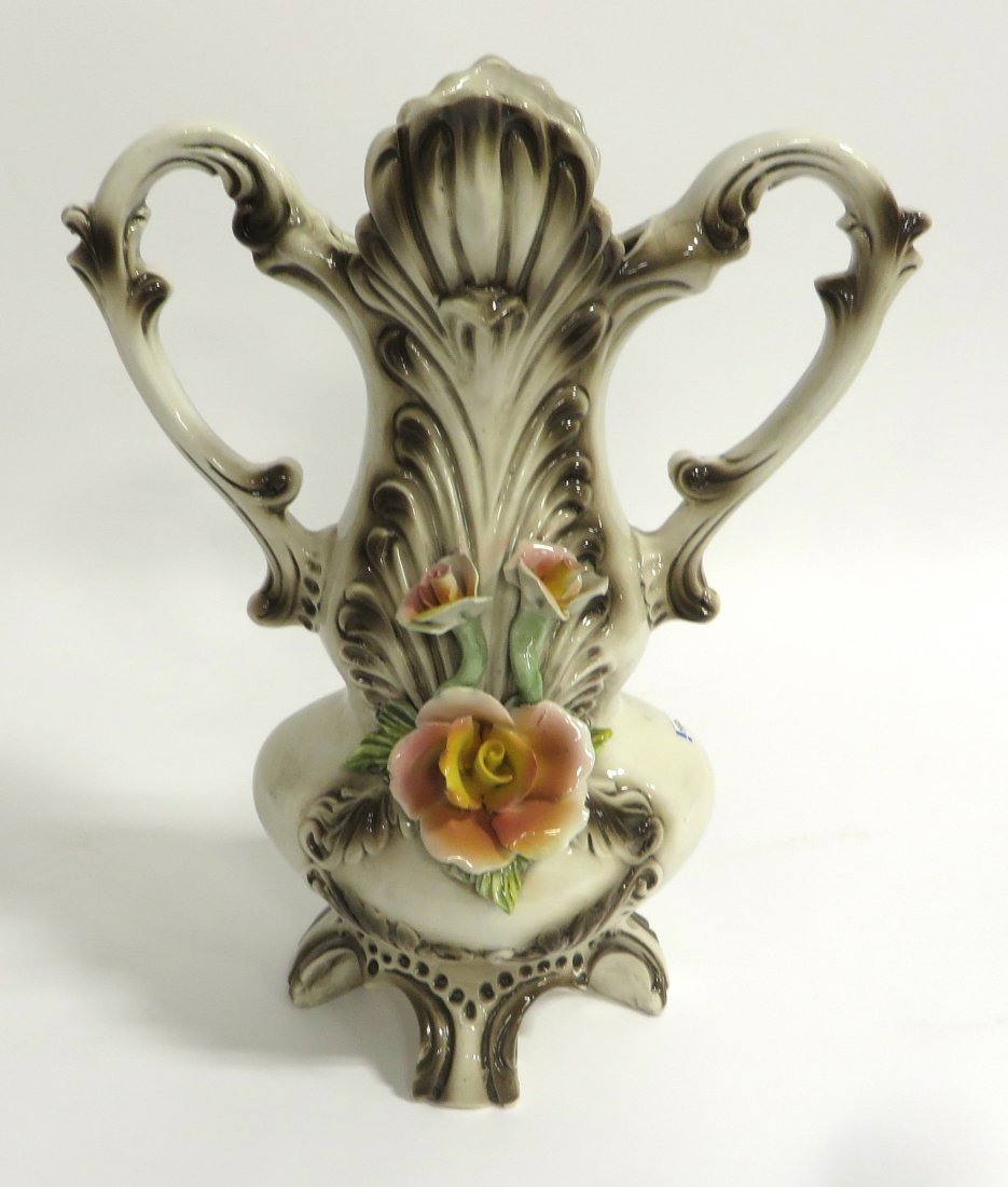 Italian Pottery Vase: Floral designs and marked Made in Italy, about 15 1/2" tall. Shipping: We are able to pack and ship this item to an address in the United States for $55.00 via USPS Priority Mail or via FedEx Ground/H