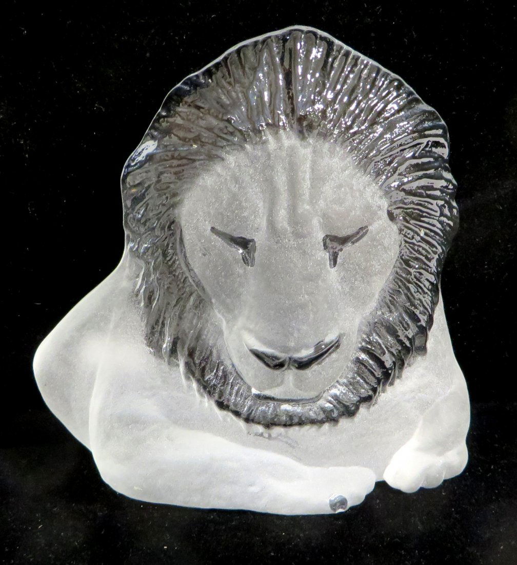Molded Glass Lion By Jonasson.: In the image of a lion's head and etch signed Jonasson. About 6" high, little use wear on the base. Shipping: We are able to pack and ship this item to an address in the United States for $30.00 via U