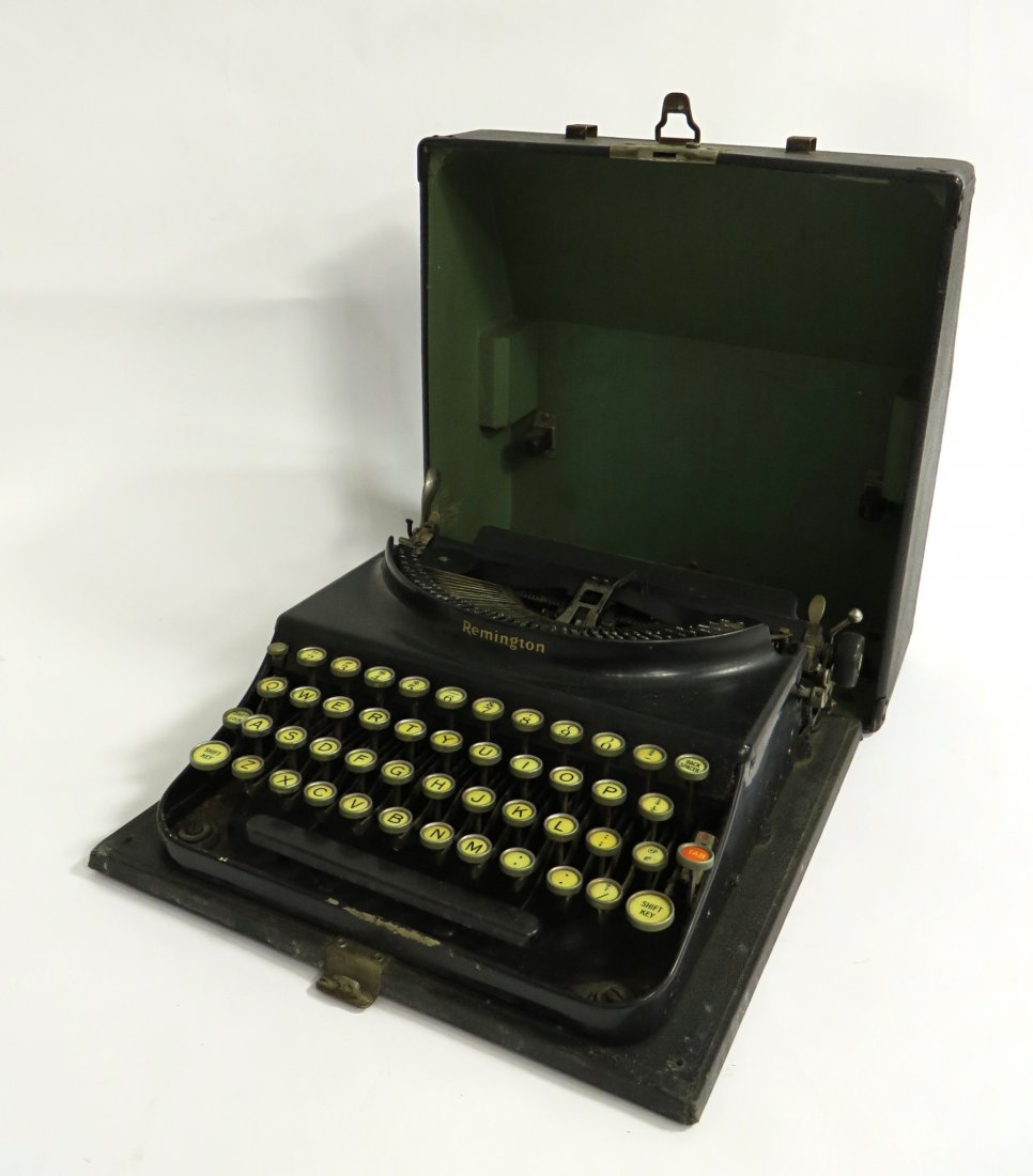 Remington Typewriter: A vintage portable typewriter in original simulated leather carrying case, 6" X 12" X 11". Looks like the early 1930s, and in good condition, possibly working. Shipping: We are able to pack and ship t