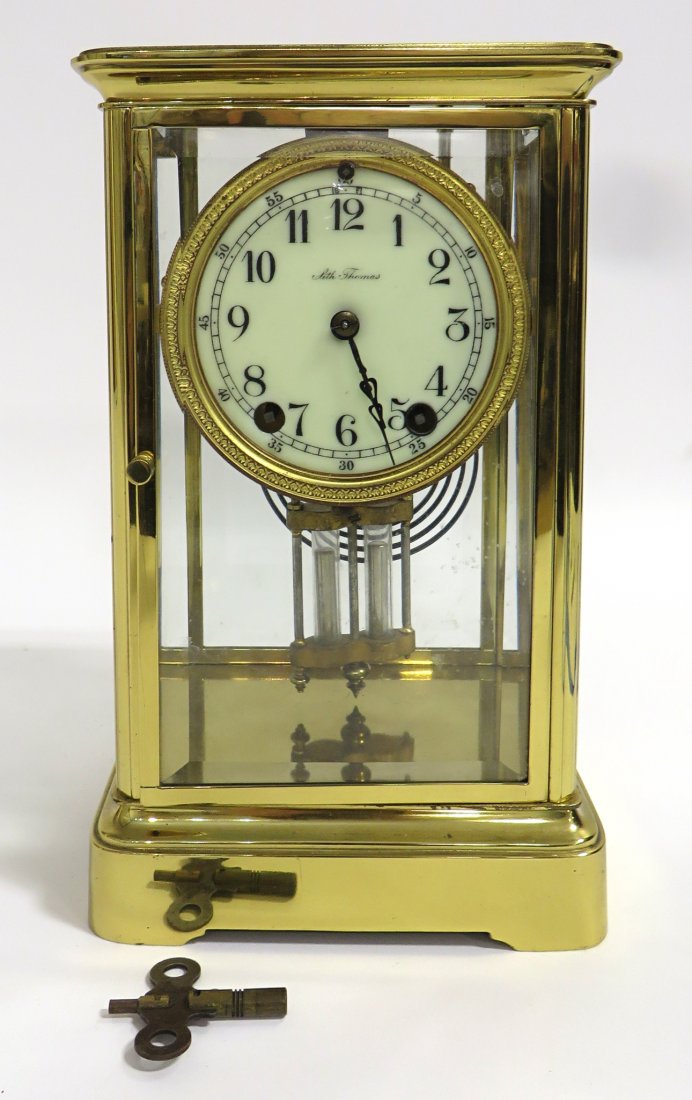 Seth Thomas Crystal Regulator: Ca 1900, with a polished and lacquered brass and bevel glass case, faux Mercury pendulum, 11" tall. Shipping: We are able to pack and ship this item to an address in the United States for $50.00 via U