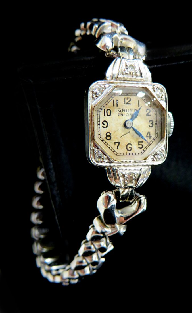 Gruen Ladies Watch: With a diamond and 14K case, newer band Shipping: We are able to pack and ship this item to an address in the United States for $25.00 via USPS Priority Mail. Tracking information will be sent to your