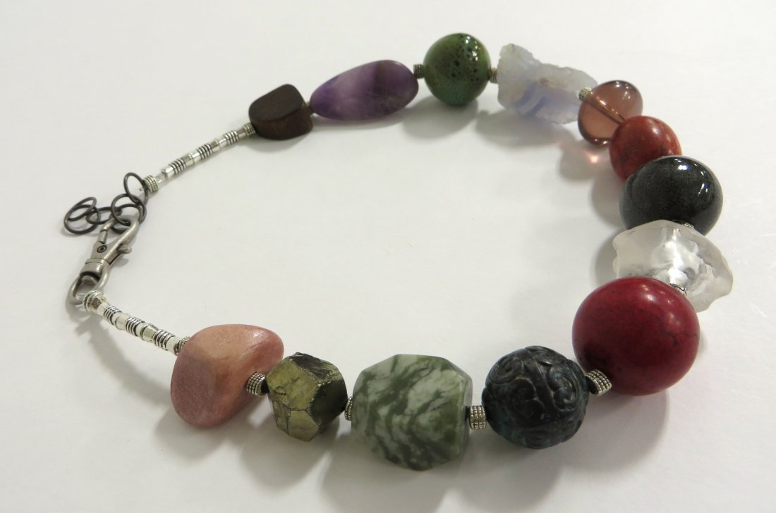 Jewelry By June Ruddell: A 17 1/2" necklace made from larger polished stones, glass, and ceramics. Jane Ruddell is a Philadelphia area craftsperson hand makes jewelry. Shipping: We are able to pack and ship this item to an ad