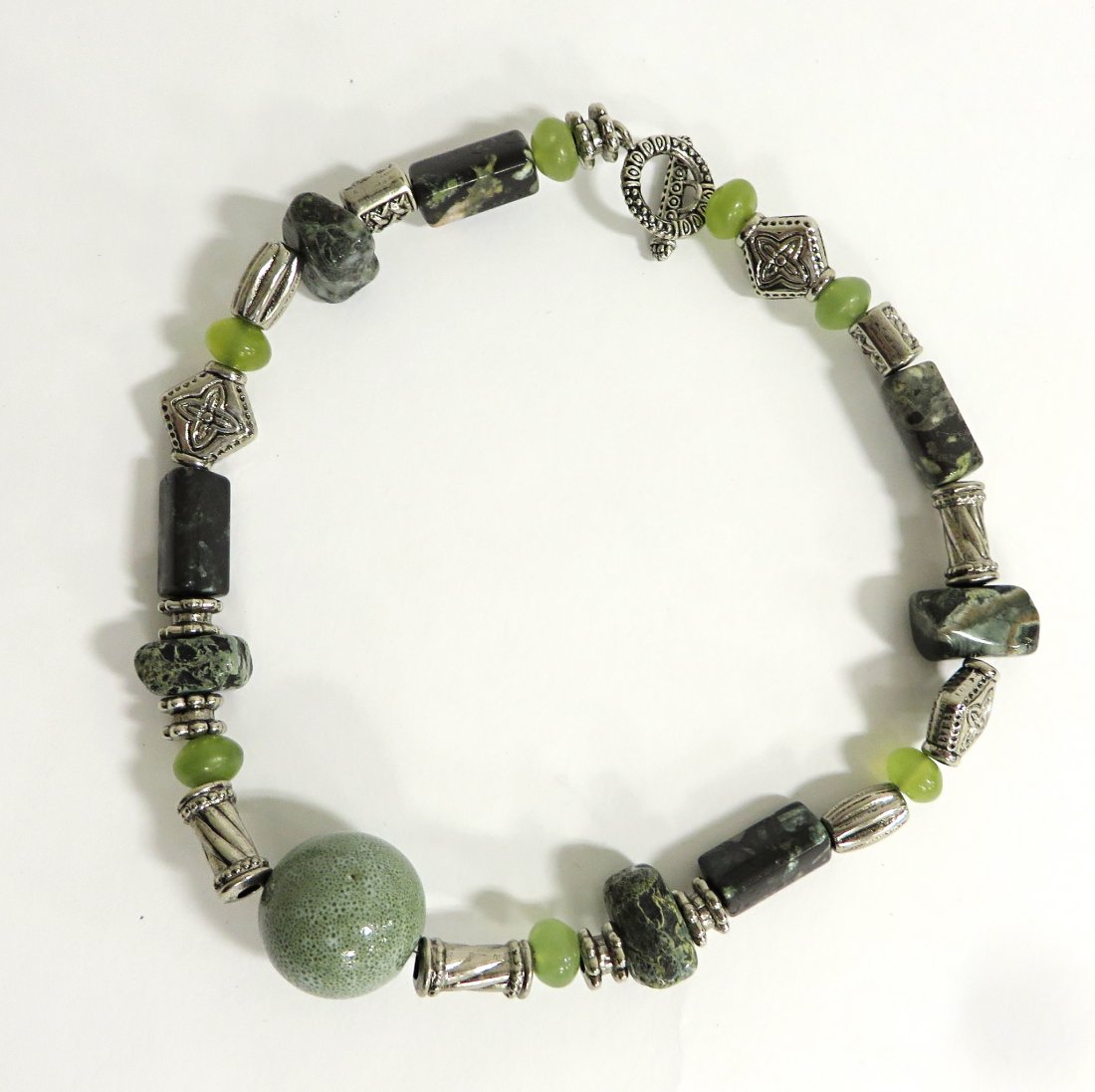 Jewelry By June Ruddell: A 16" choker comprised of metal devices natural stones and ceramics. Shipping: We are able to pack and ship this item to an address in the United States for $15.00 via USPS Priority Mail. Tracking inf