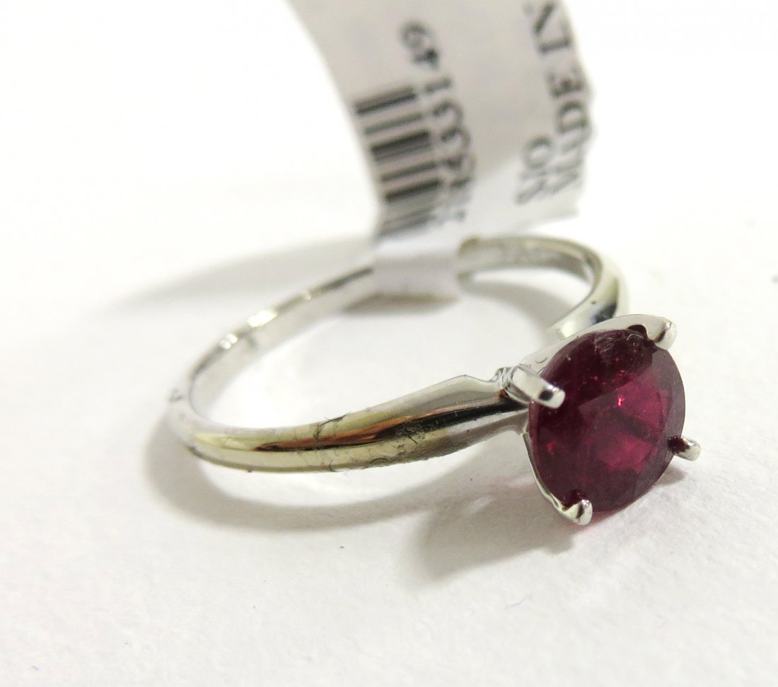 Ruby Ring: A silver mounted solitaire ring with a 1.06 ctw red ruby. Shipping: We are able to pack and ship this item to an address in the United States for $15.00 via USPS Priority Mail. Tracking information wi