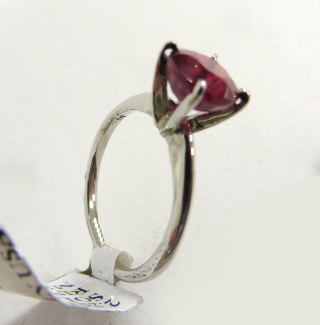Ruby Solitaire Ring: With a 14 K mount and featuring a 2.25 red ruby. Shipping: We are able to pack and ship this item to an address in the United States for $15.00 via USPS Priority Mail. Tracking information will be sen