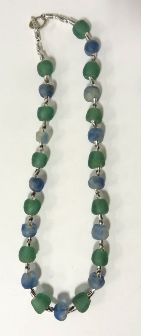 Jane Ruddell Design Jewelry: Weathered strand of alternating white and green glass beads. Shipping: We are able to pack and ship this item to an address in the United States for $25.00 via USPS Priority Mail. Tracking information