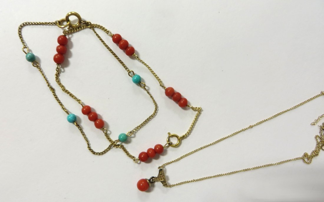 Necklace And Two Bracelets: Two bracelets in both turquoise colored and coral colored beads and a necklace with fine gold chain. We are not gemlogists. Our representations and opinions of these jewelry items are not guaranteed. 