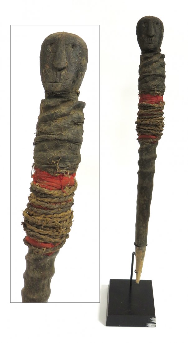 African Tanzanian Power Horn: Rare antique object, made from animal horn, wood (with traces of original paint) and string and cloth. Complete with custom mounting stand. Possibly 19th century. Stands 22" in height and with custom 