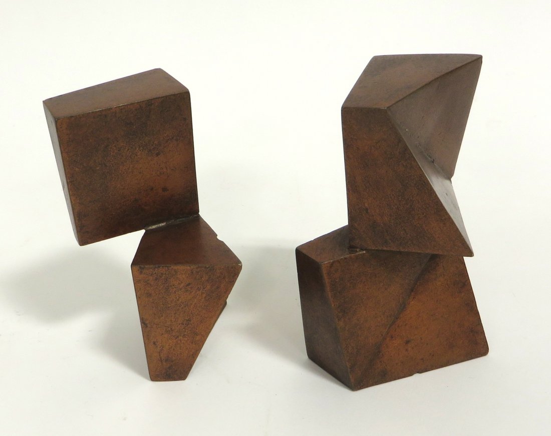 Mid Century Modern Pair Stone/Ceramic Sculptures: 4" in height, possibly used as book ends. Can intersect however you like. Shipping: We are able to pack and ship this item to an address in the United States for $30.00 via USPS Priority Mail. Trackin